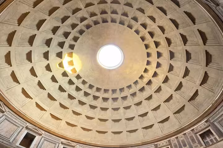 Interior view of the Pantheon's iconic oculus and coffered dome, highlighting its architectural brilliance.