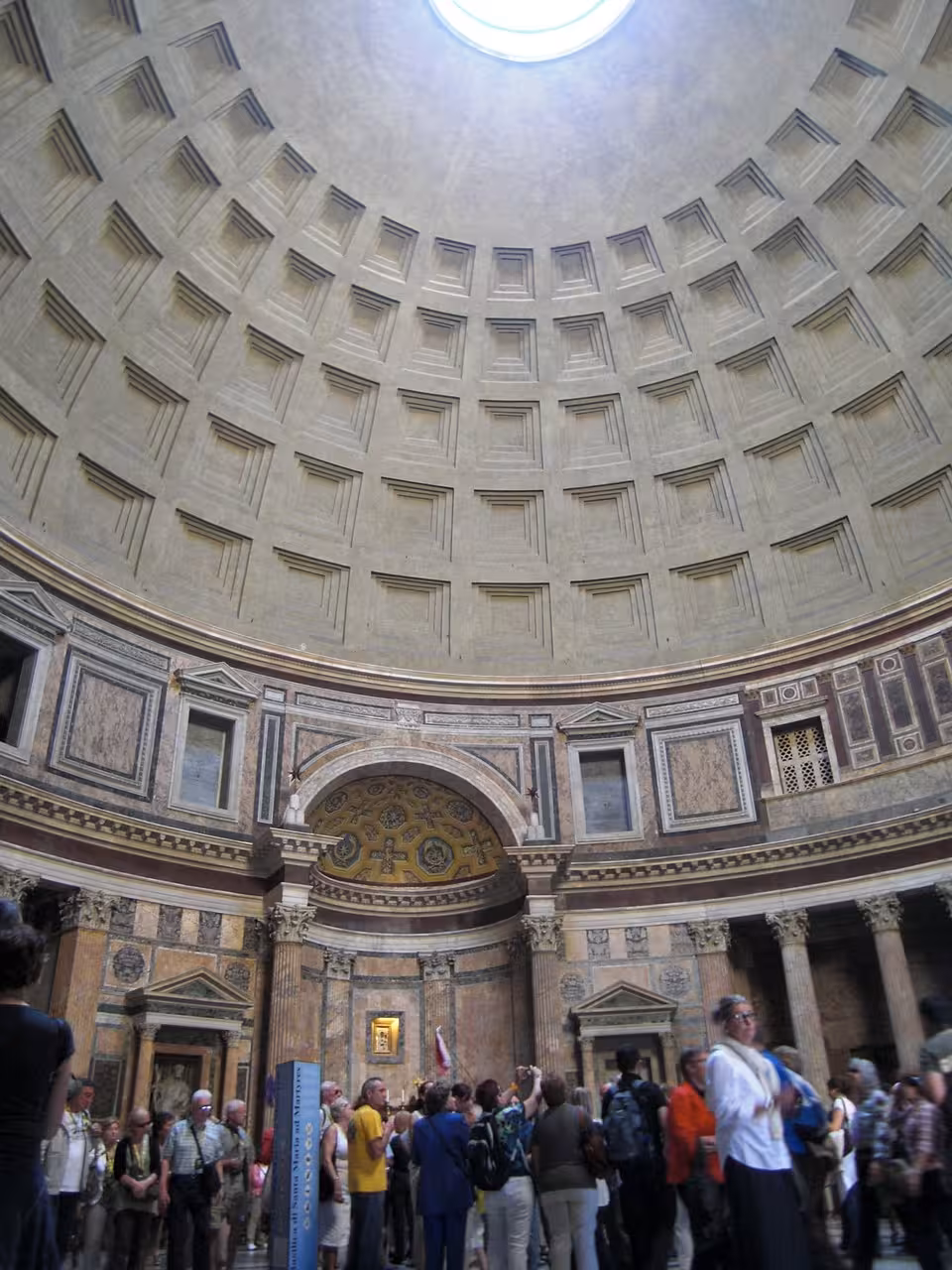 Visitors inside Rome's Pantheon, marveling at the grand oculus and ancient architecture with priority tickets.