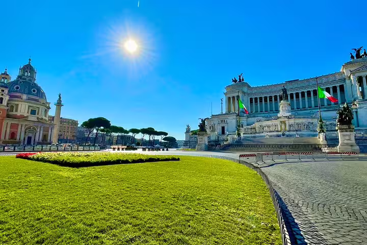 Sunlit Piazza Venezia with Altare della Patria monument in Rome, visited on guided shore excursion from Civitavecchia cruise port