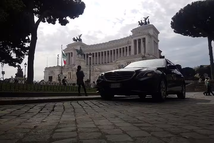 Luxury private car at Piazza Venezia with Vittoriano monument, Rome private half-day sightseeing tour