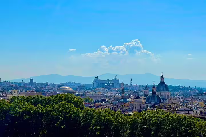 Panoramic skyline of Rome with domes and monuments seen on a private city sightseeing tour before visiting the underground catacombs