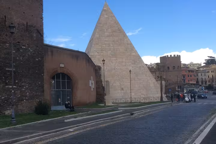 View of Rome's historic Pyramid of Cestius near the Testaccio neighborhood, a highlight on private food tours.