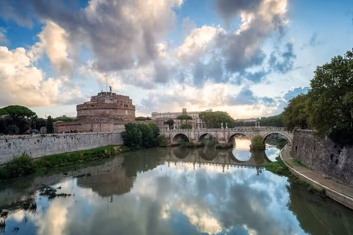 Tiber River panorama with Castel Sant’Angelo and bridge, part of Rome walking tour with Vatican hosted entry