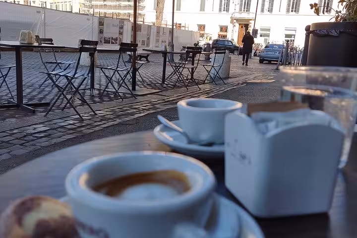 Enjoy a morning coffee at a charming Roman cafe during the Rome Highlights by Vespa private guided tour.