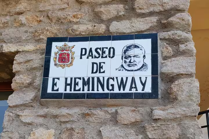 Sign for Paseo de Hemingway in Ronda, highlighting the city's literary connection on the walking tour.