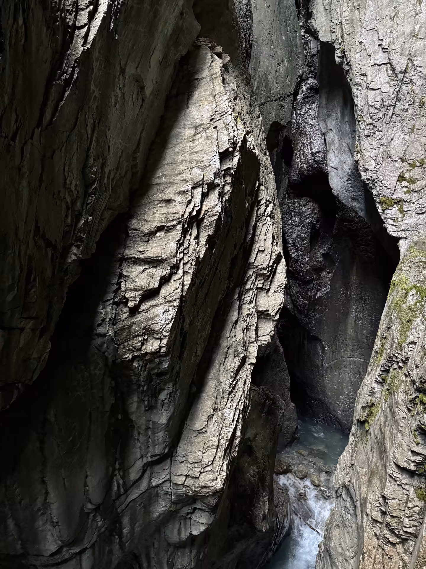 Narrow Rosenlaui Gorge rock corridor with turquoise water below, highlight of a private Rosenlaui Valley e-bike tour