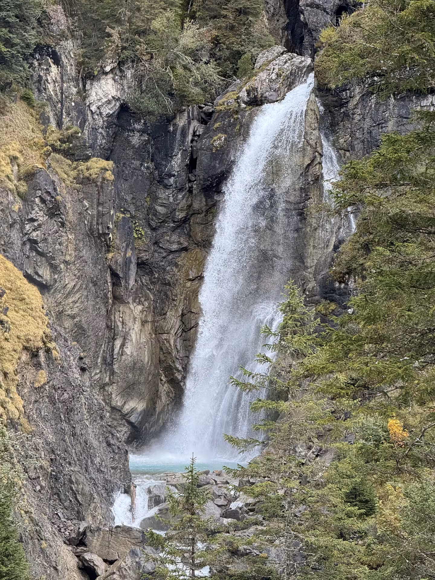 Rosenlaui Gorge waterfall and turquoise pool on a private Rosenlaui Valley e-bike tour in the Swiss Alps