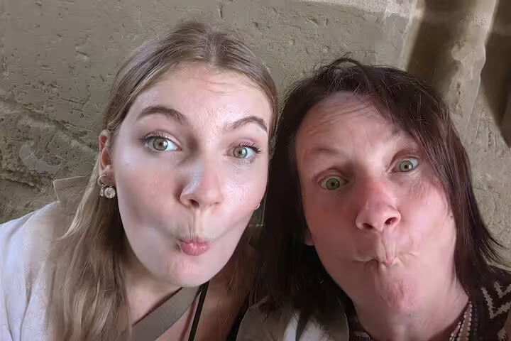 Two travelers taking a fun selfie during the Rothenburg scavenger hunt, exploring medieval sights on a self-guided tour