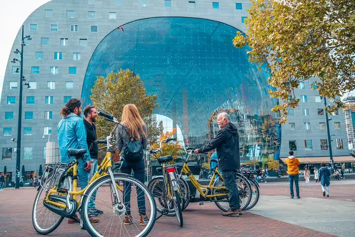 Cyclists meet at Rotterdam Markthal on a classic highlights bike tour with a local guide in the city center