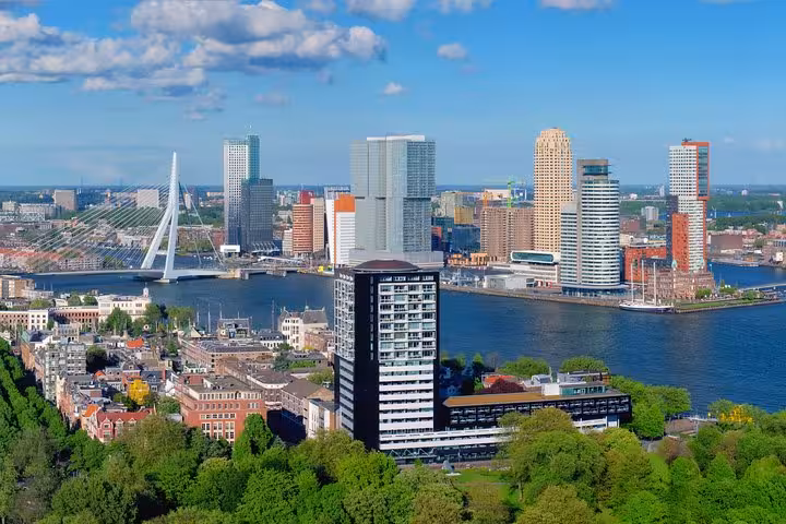 Rotterdam skyline and Erasmus Bridge over the Nieuwe Maas, featured on Famous Holland tour from Amsterdam