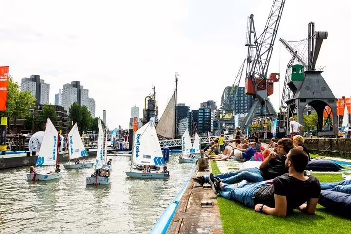 Rotterdam harbor scene with sailboats and cranes, a highlight on Amsterdam to Rotterdam private tour with local guide