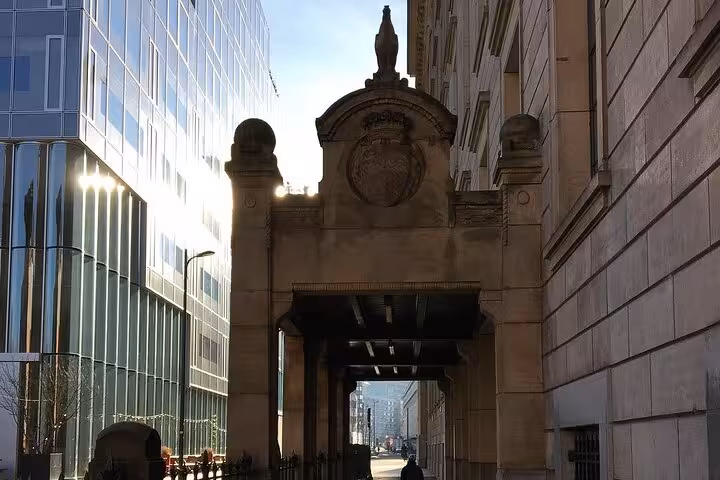 Historic archway in central Rotterdam beside modern glass towers on Your Own Holland private tour