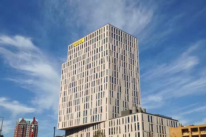 Rotterdam modern high-rise skyline under blue sky, featured on Your Own Holland private sightseeing tour