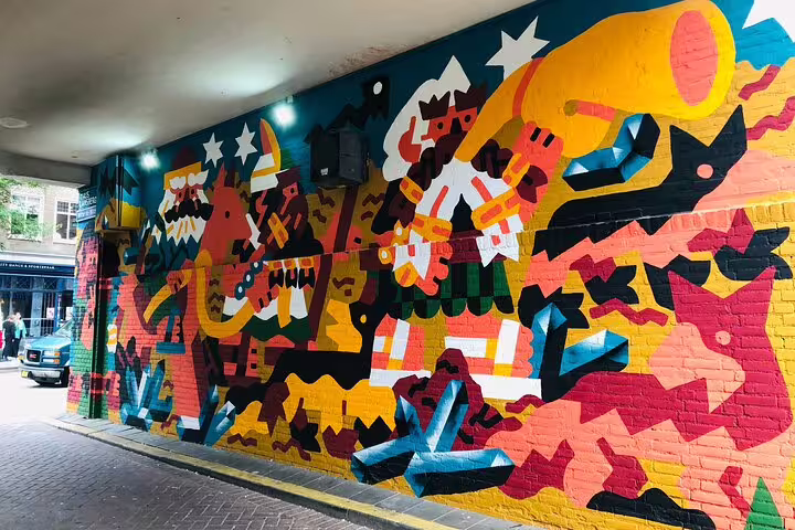Vibrant tunnel wall mural in Rotterdam, a highlight stop on a private street art walking tour experience