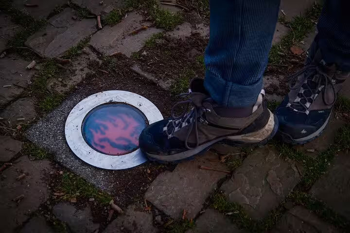 Traveler steps on interactive street light, a hidden gem stop on Rotterdam highlights walking tour with local guide