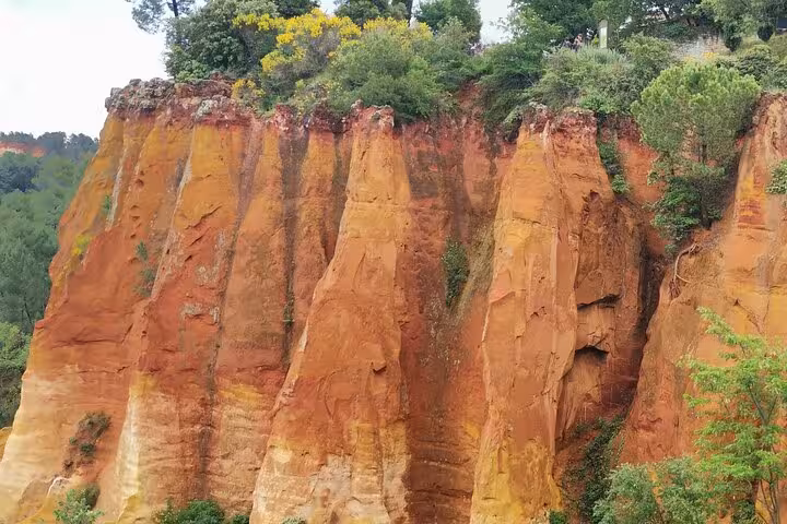 Rust-red ochre cliffs at Roussillon seen on a Provence private tour with driver and luxury vehicle