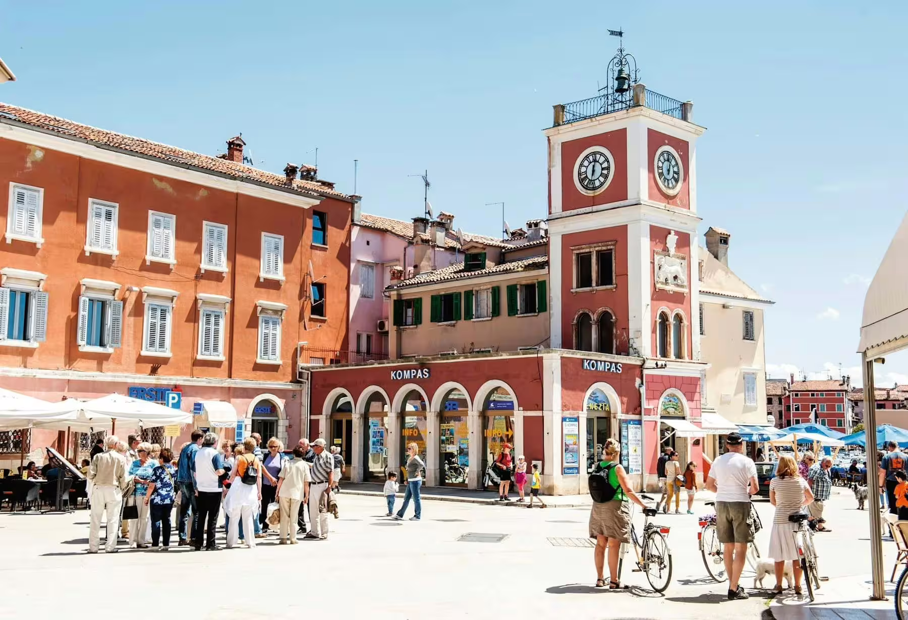 Rovinj main square with clock tower and lively market streets, a stop on Istrian Coast boat cruise from Poreč