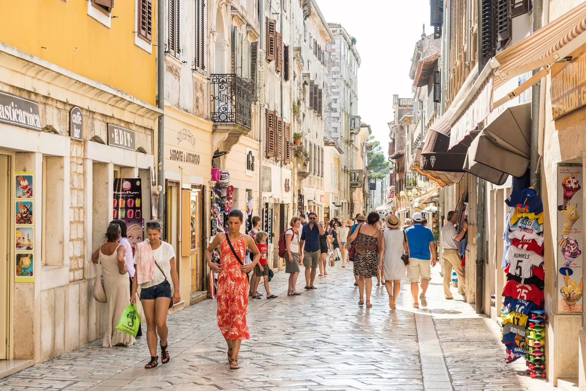 Old Town Rovinj pedestrian street with shops and cafes, part of Ancient Istria tour from Rovinj to Pula