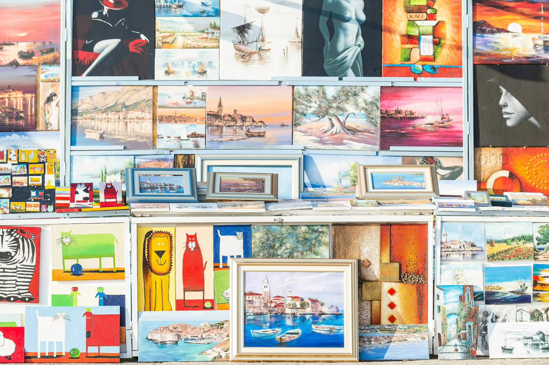 Colorful street art market in Rovinj, Istria, showcasing local paintings on the Ancient Istria tour from Rovinj