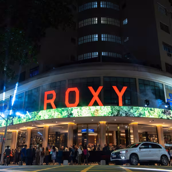 Exterior of Roxy Copacabana at night with vibrant lights, perfect for Rio By Night VIP: Dinner + Cultural Show.