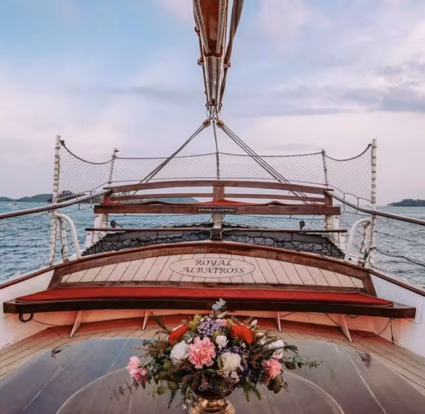 Scenic view from the Royal Albatross deck adorned with flowers, offering a luxurious sunset cruise experience.