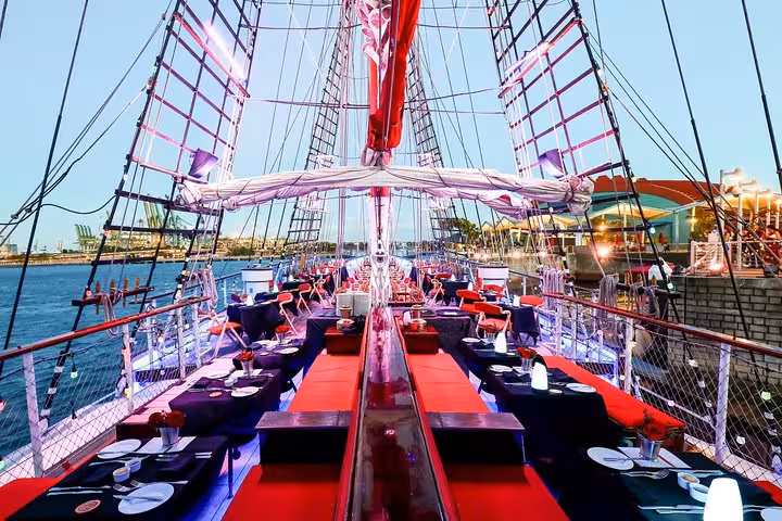 Elegant deck setup on Royal Albatross with ambient lighting, perfect for a sunset cruise and 7-course dinner.