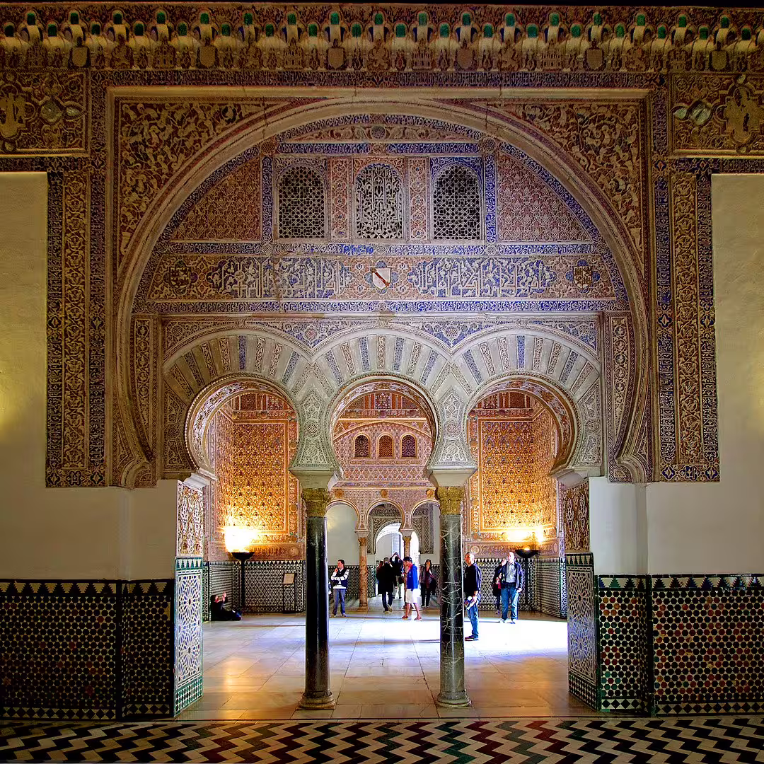 Intricately decorated arches and vibrant tiles inside the Royal Alcazar of Seville during a private guided tour.