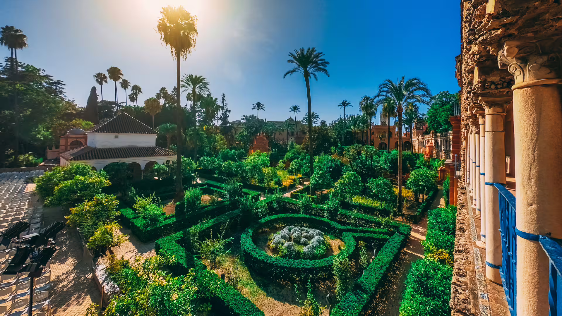 Lush gardens and historic architecture of the Royal Alcazar of Seville, perfect for a private guided tour experience.