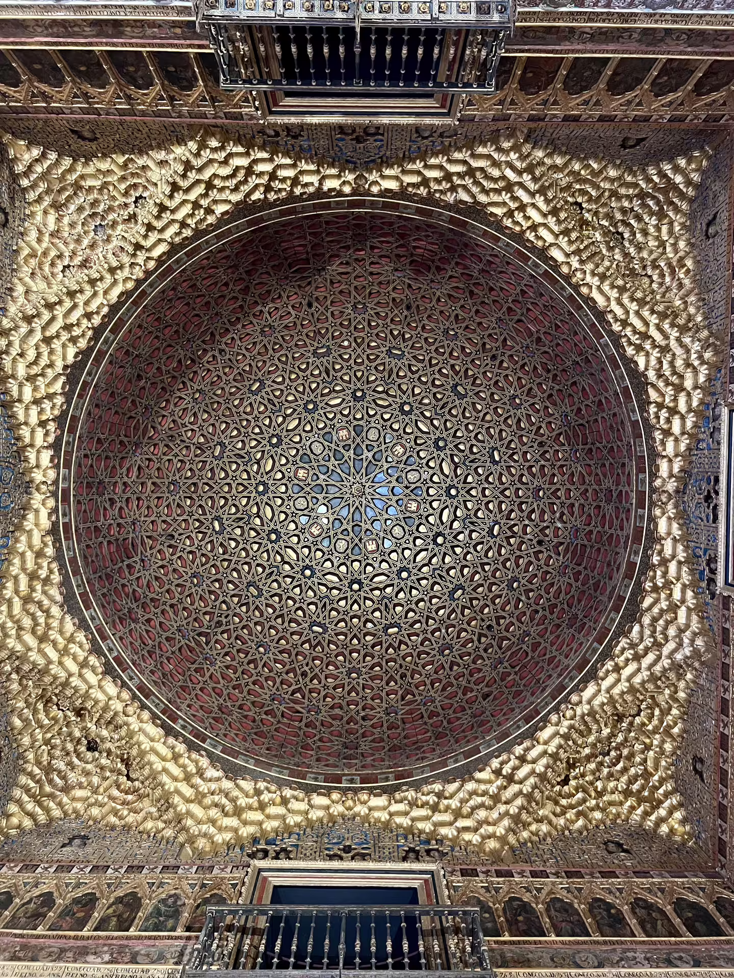 Intricate golden dome ceiling inside the Royal Alcazar of Seville, showcasing exquisite Mudejar architecture on a private tour.