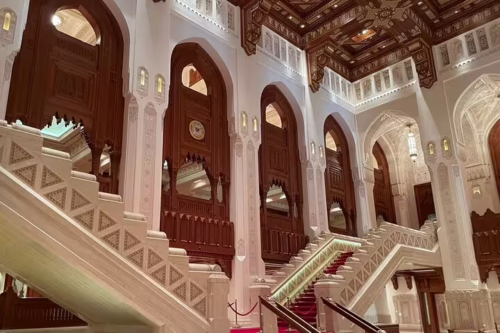 Discover the opulent interiors of the Royal Opera House Muscat on a private guided city tour in Oman.