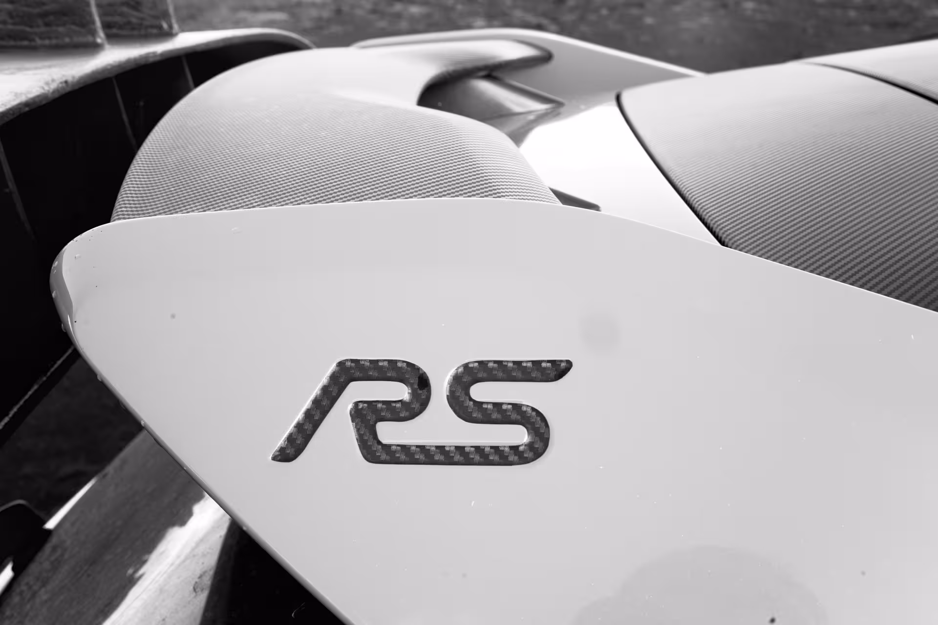 Close-up of RS badge on rally car spoiler, South Coast Adventure Rally Car Edition performance details
