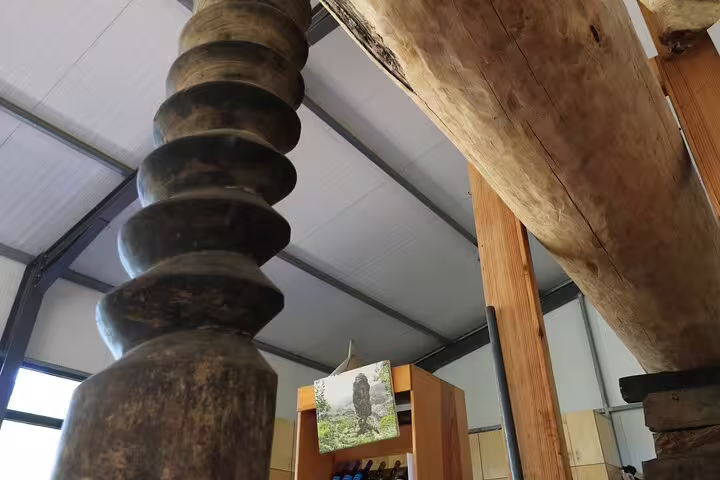Close-up of a rustic winery interior showcasing vintage wine press equipment, perfect for an immersive wine tour and tasting adventure.