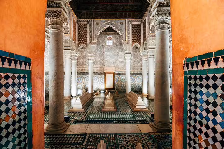 Saadian Tombs interior in Marrakech, ornate columns and mosaic tiles on a half-day local guided tour