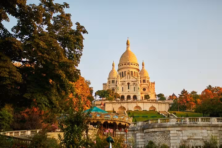 Sacré-Cœur Basilica view from Montmartre gardens, highlight of Paris street art walking tour and drink tasting
