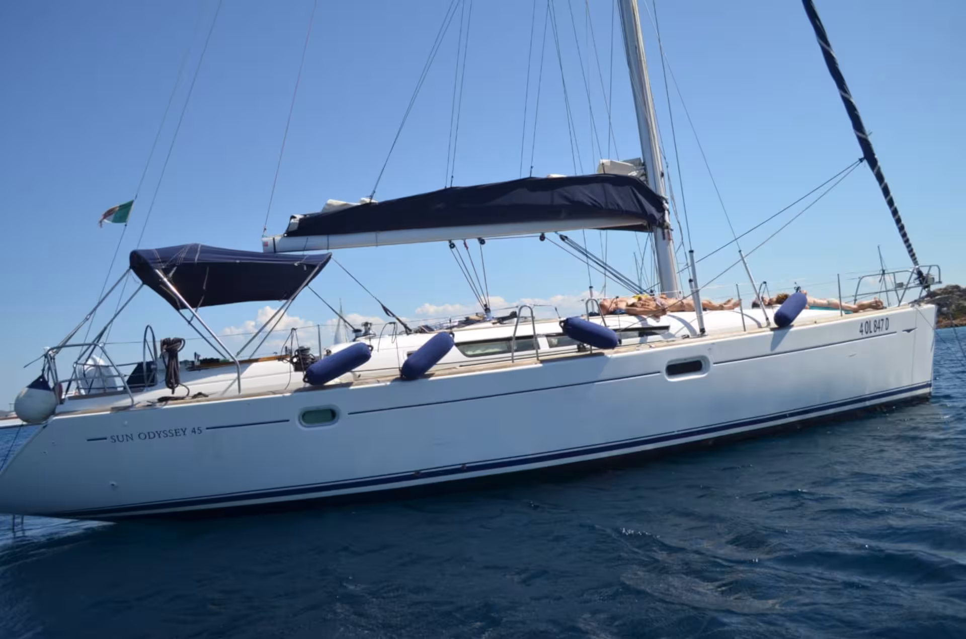Elegant sailboat on a sunny day in La Maddalena Archipelago, ideal for a full-day sailing excursion from Palau.