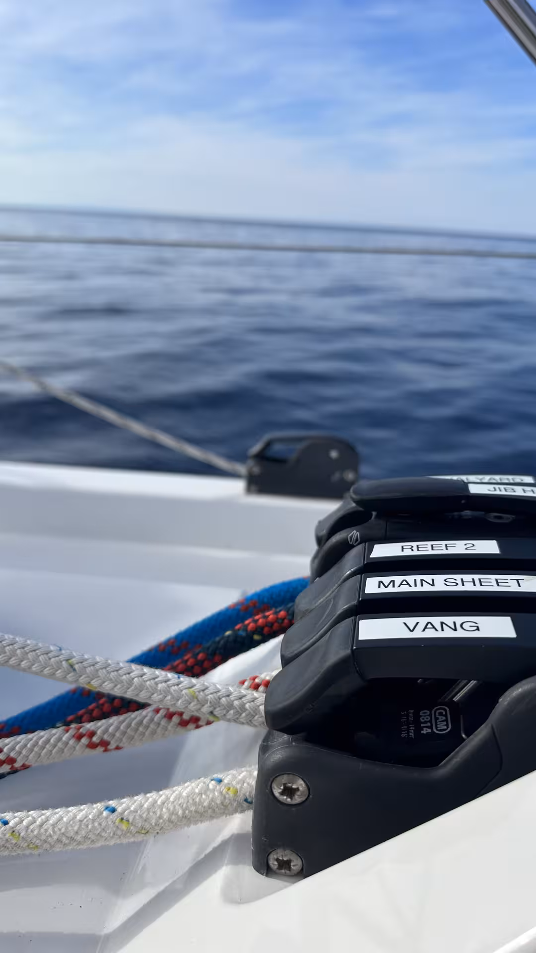 Labeled sailboat rope clutches and lines on deck, hands-on Zero to Hero sailing course at sea
