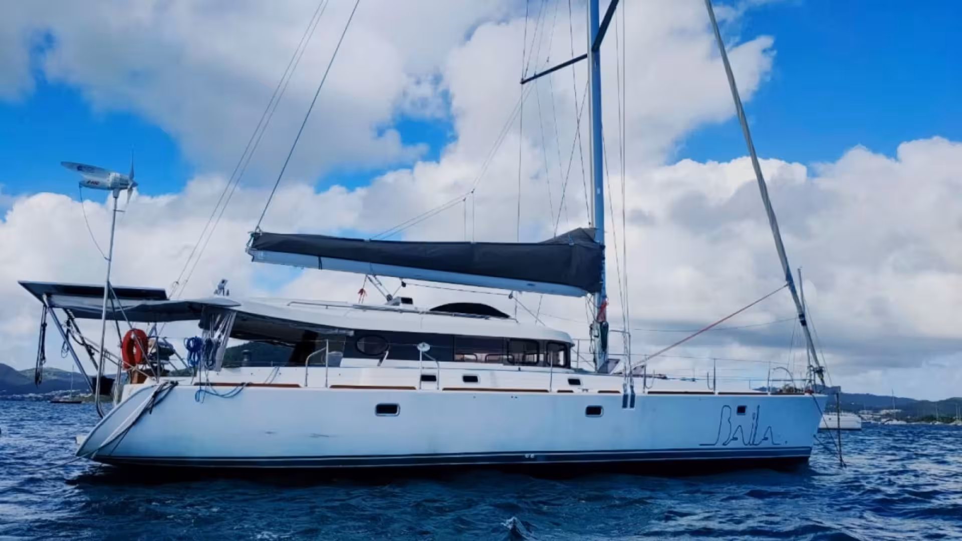 Sailboat on the open sea during a Tavolara Marine Area tour from Golfo Aranci.