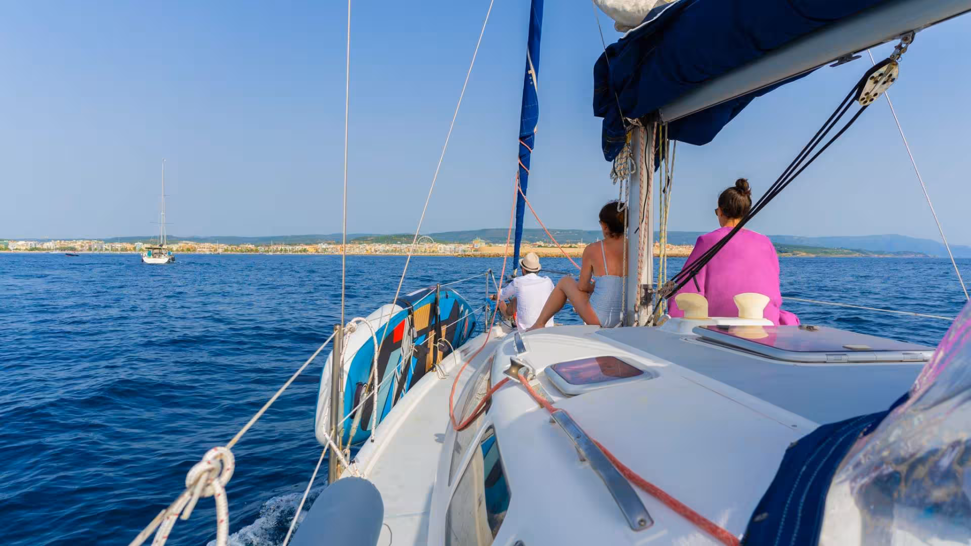 Sailing adventure in Porto Conte Park, Alghero, with stunning views of the coastline and sparkling sea.