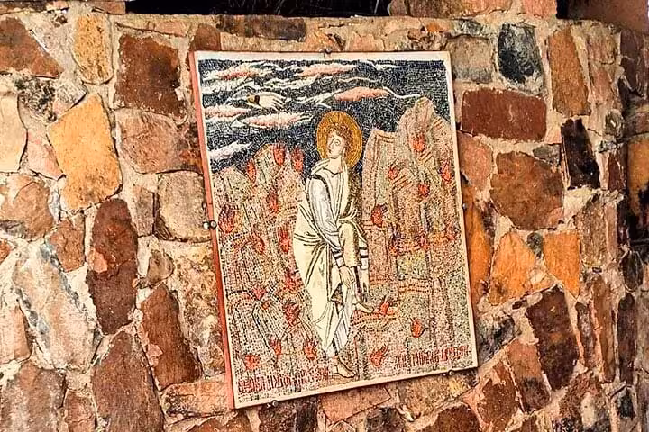 Religious mosaic icon on stone wall at Saint Catherine Monastery, stop on Dahab day tour from Sharm