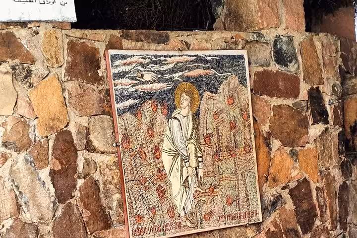 Ancient mosaic icon on stone wall at Saint Catherine Monastery, cultural stop on Saint Catherine hike tour