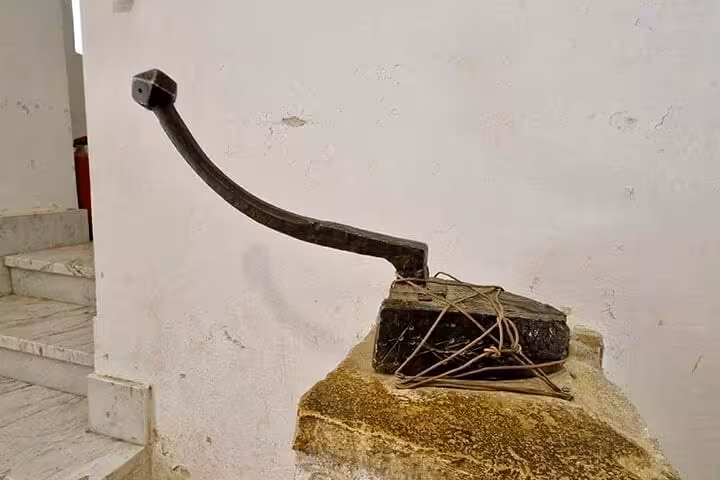 Ancient monastery oil press artifact at Saint Catherine Monastery, Sinai, on Dahab day trip from Sharm