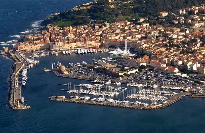 Aerial view of Saint Tropez harbor marina with yachts and old town, Provence private tour from Hyeres