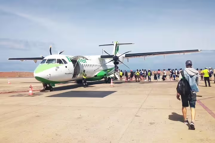 Passengers boarding plane at Sal Island Airport, Cabo Verde, for pre-booked private transfer to Espargos