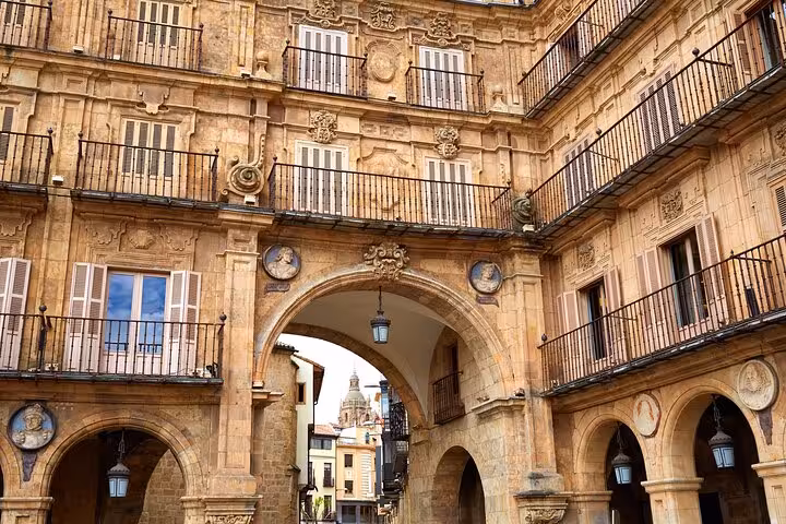 Ornate architecture of Salamanca's Plaza Mayor, featuring intricate balconies and arches ideal for city exploration.