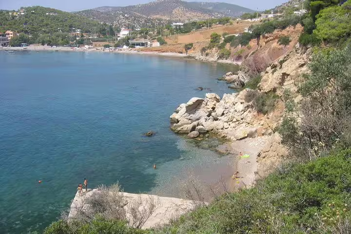Rocky cove and clear waters on Salamina Island, ideal swimming stop on a full-day private tour from Athens