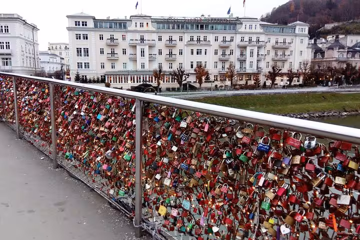 Love locks on Makartsteg bridge with Salzburg riverside views on a private day tour from Vienna with guide