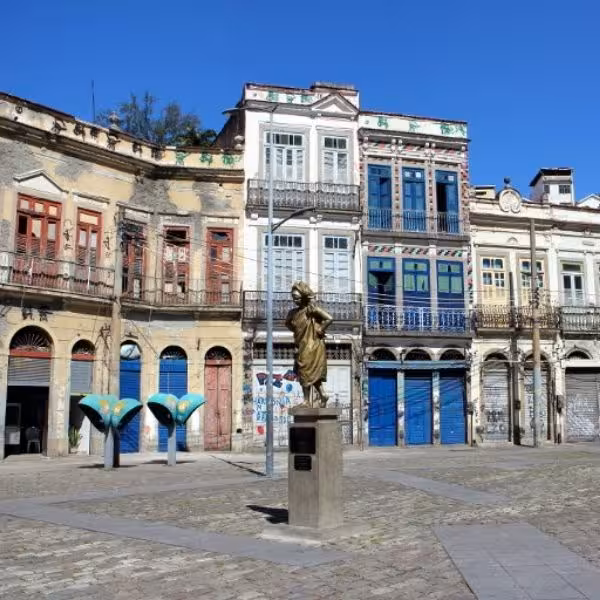 Colorful historic buildings with a statue in Rio, highlighting the rich cultural heritage of the Samba tour.