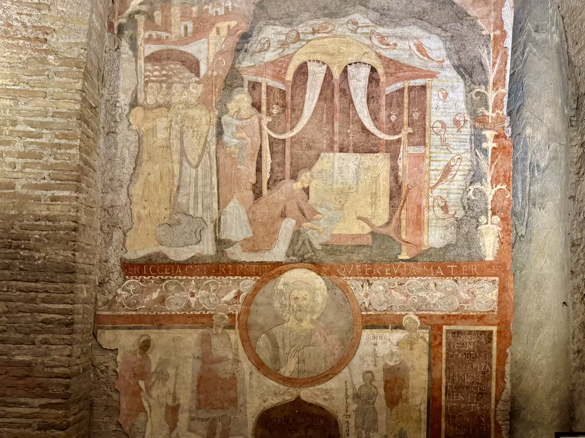 Ancient fresco of early Christian scenes in the underground levels of San Clemente Basilica on a Rome hidden temples tour