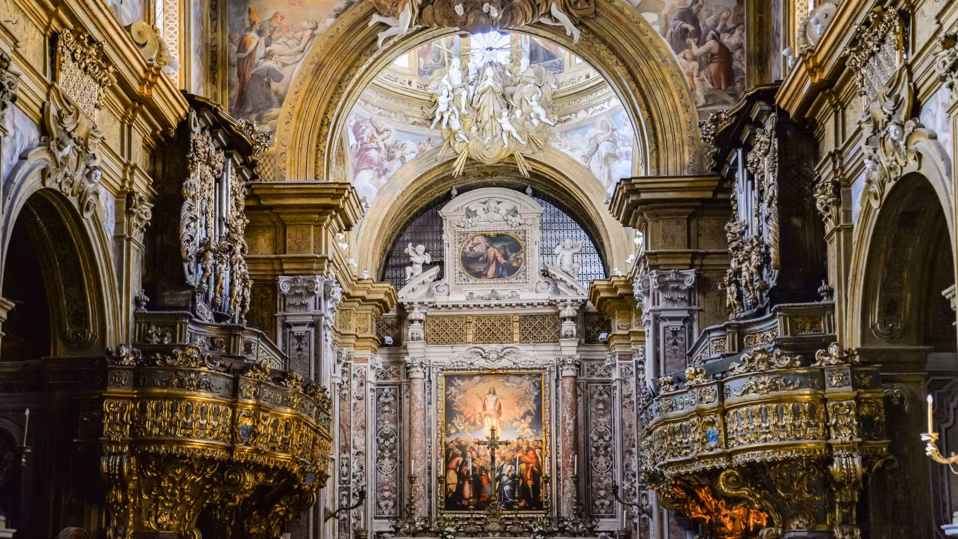 Ornate interior of San Gennaro Chapel in Naples, showcasing intricate baroque details and religious artwork.
