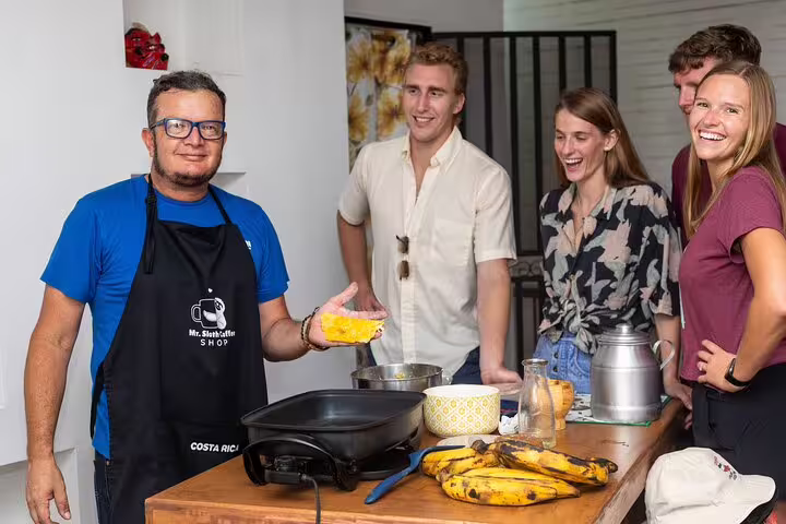 Tour group in San Jose enjoying a cooking class with local chef during a Bites and Sights food tour.